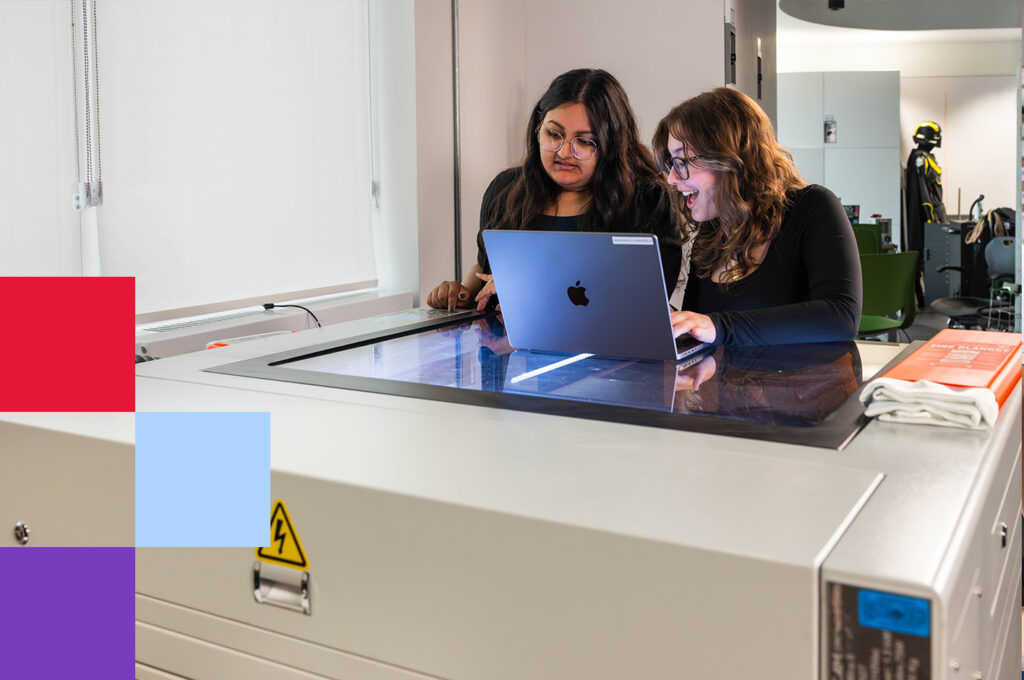 Two York University students using a laptop to work on a laser cutting machine at the AMPD Makerspace, exploring digital fabrication and creative design.